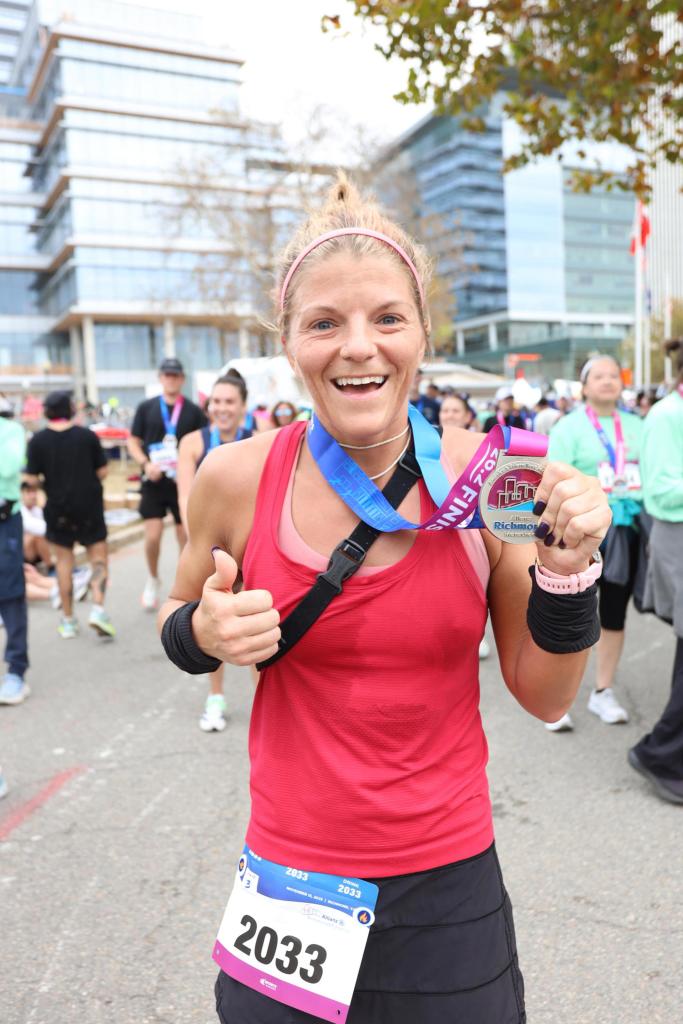 Woman with medal after finishing race